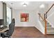 Open entryway featuring hardwood floors, stairs, and neutral colors at 207 Harmony Lake Dr, Canton, GA 30115