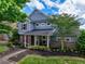 Charming two-story home with stone accents, well-maintained landscaping, and inviting curb appeal at 207 Harmony Lake Dr, Canton, GA 30115