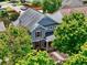 Stylish two-story home featuring stone accents, dormer windows, well manicured landscaping and mature trees at 207 Harmony Lake Dr, Canton, GA 30115