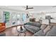 Bright living room with hardwood floors, open to kitchen, and access to outdoor deck at 207 Harmony Lake Dr, Canton, GA 30115