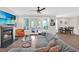 Spacious living room with fireplace, comfortable seating, access to a patio, and an adjacent dining area at 207 Harmony Lake Dr, Canton, GA 30115
