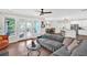 Bright living room with open floor plan, hardwood floors, and access to outdoor deck at 207 Harmony Lake Dr, Canton, GA 30115