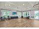 Large lounge area showcases neutral decor, modern lighting, TV, and comfortable seating arrangements at 207 Harmony Lake Dr, Canton, GA 30115