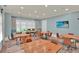 Bright meeting room featuring tables, chairs, neutral walls, and large windows offering views at 207 Harmony Lake Dr, Canton, GA 30115