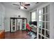 Bright home office with a ceiling fan, wood floors, and plenty of natural light at 207 Harmony Lake Dr, Canton, GA 30115