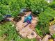 Aerial view of a colorful playground surrounded by lush landscaping and mature trees at 207 Harmony Lake Dr, Canton, GA 30115