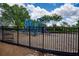 Community playground perfect for , featuring slides, climbing structures, and a safety fence at 207 Harmony Lake Dr, Canton, GA 30115