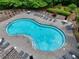 A serene pool with ample lounge seating provides a perfect spot for relaxation and enjoyment at 207 Harmony Lake Dr, Canton, GA 30115