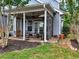 Cozy screened porch with ceiling fan, outdoor seating, and access to the backyard at 207 Harmony Lake Dr, Canton, GA 30115