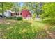 Charming backyard with a white picket fence and lush greenery, offering a peaceful retreat at 350 Pleasant Oak Sw Ct, Marietta, GA 30008