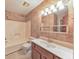 Bathroom features a single sink vanity, wallpaper, and tub/shower combo at 350 Pleasant Oak Sw Ct, Marietta, GA 30008