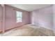 Bedroom with lavender walls, beige carpet, and a single window at 350 Pleasant Oak Sw Ct, Marietta, GA 30008