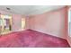 Bedroom with pink carpet and walls, doorway to hall and bath at 350 Pleasant Oak Sw Ct, Marietta, GA 30008