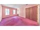 Large bedroom with two windows and a closet for ample storage at 350 Pleasant Oak Sw Ct, Marietta, GA 30008