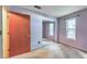 Bedroom with a window view, neutral walls, and mirrored closet doors at 350 Pleasant Oak Sw Ct, Marietta, GA 30008