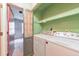 Laundry room with washer, dryer and shelving at 350 Pleasant Oak Sw Ct, Marietta, GA 30008