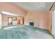 Bright living space with a cozy fireplace, open layout to the kitchen, and a sliding door leading to the deck at 350 Pleasant Oak Sw Ct, Marietta, GA 30008