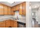 Kitchen featuring stone countertops, stainless steel appliances, and wood cabinets at 1602 Sycamore Nw Dr, Kennesaw, GA 30152