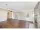 Spacious open living area with wood floors and glass sliding doors at 1602 Sycamore Nw Dr, Kennesaw, GA 30152