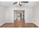 Open living area with wood floors and an inviting view into the eat-in kitchen, perfect for entertaining at 1602 Sycamore Nw Dr, Kennesaw, GA 30152