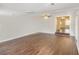 Spacious living area featuring hardwood floors and steps down to an additional living area at 1602 Sycamore Nw Dr, Kennesaw, GA 30152