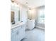 Bright bathroom featuring double vanities, modern fixtures, and a well-lit mirror at 2462 Adair Ridge Ct, Decatur, GA 30034