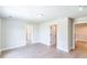 Bright bedroom with light hardwood floors and multiple doorways with white trim at 2462 Adair Ridge Ct, Decatur, GA 30034