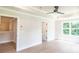Bright bedroom with a tray ceiling, fan, walk-in closet, and a large window at 2462 Adair Ridge Ct, Decatur, GA 30034