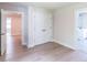 Bedroom with closet, white trim, light hardwood floors, and ensuite bathroom at 2462 Adair Ridge Ct, Decatur, GA 30034