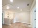 Hallway featuring a staircase, neutral walls, and hardwood floors at 2462 Adair Ridge Ct, Decatur, GA 30034