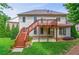 A backyard features a two-level deck, lawn, and abundant landscaping at 3394 Bryerstone Se Cir, Smyrna, GA 30080