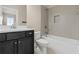 Clean bathroom with a white tiled shower, toilet, and a dark vanity with a light countertop at 3394 Bryerstone Se Cir, Smyrna, GA 30080