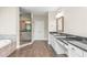 A luxury bathroom features granite countertops, tiled floors, walk-in shower and soaking tub at 3394 Bryerstone Se Cir, Smyrna, GA 30080