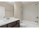 Bathroom features a dark vanity and tub with white tiling at 3394 Bryerstone Se Cir, Smyrna, GA 30080