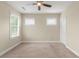A bedroom featuring carpet floors, ceiling fan, base molding and natural light at 3394 Bryerstone Se Cir, Smyrna, GA 30080
