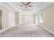 Bedroom with tray ceiling and two doors at 3394 Bryerstone Se Cir, Smyrna, GA 30080