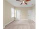 Bedroom featuring a ceiling fan, and two white doors with carpet flooring at 3394 Bryerstone Se Cir, Smyrna, GA 30080