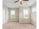 A bedroom featuring carpet floors, ceiling fan and natural light at 3394 Bryerstone Se Cir, Smyrna, GA 30080