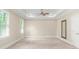 Large bedroom with carpet, tray ceiling, and ample natural light at 3394 Bryerstone Se Cir, Smyrna, GA 30080