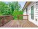 A spacious wooden deck with railings offers views of the surrounding greenery at 3394 Bryerstone Se Cir, Smyrna, GA 30080