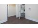 Hallway features hardwood floors, white trim, and an open view to the garage at 3394 Bryerstone Se Cir, Smyrna, GA 30080