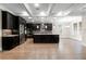 Open kitchen design with dark cabinets, a large island, stainless appliances, and bright lighting at 3394 Bryerstone Se Cir, Smyrna, GA 30080