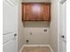 A laundry room features overhead wood cabinets and tile floors at 3394 Bryerstone Se Cir, Smyrna, GA 30080
