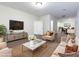 Inviting living room with neutral colors, hardwood floors, and a view of the dining area at 3394 Bryerstone Se Cir, Smyrna, GA 30080