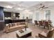 Bright, open-concept living space featuring hardwood floors, coffered ceilings, and an adjacent dining area at 3394 Bryerstone Se Cir, Smyrna, GA 30080