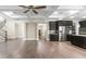 Open living space with hardwood floors, stainless steel appliances, and an adjacent staircase at 3394 Bryerstone Se Cir, Smyrna, GA 30080