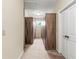 A long walk-in closet with wood cabinets and carpet floors at 3394 Bryerstone Se Cir, Smyrna, GA 30080