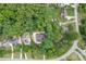 Aerial view of the property surrounded by lush greenery and neighborhood at 4355 Old Hamilton Mill Rd, Buford, GA 30518