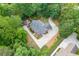 Aerial view of the property showcasing the house, garage, driveway, and landscaping at 4355 Old Hamilton Mill Rd, Buford, GA 30518