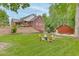 Expansive backyard showcasing a seating area, playground, and well-maintained landscaping at 4355 Old Hamilton Mill Rd, Buford, GA 30518